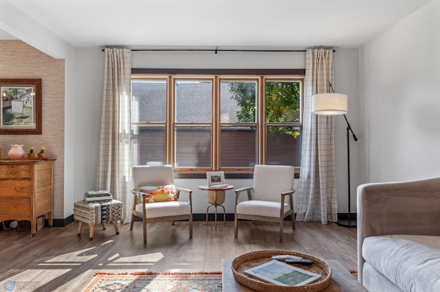 living area with hardwood / wood-style floors