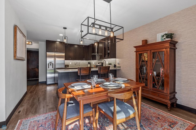 dining space featuring dark hardwood / wood-style flooring