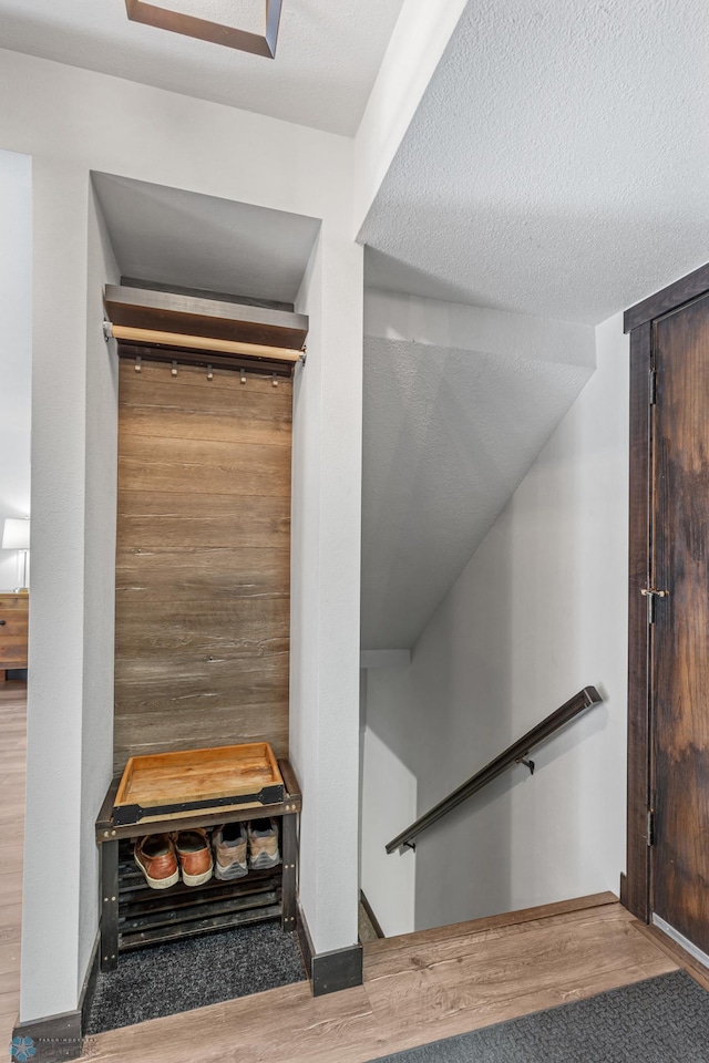 interior space with hardwood / wood-style flooring and a textured ceiling