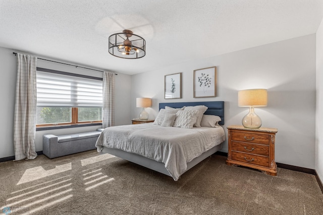 carpeted bedroom featuring a textured ceiling