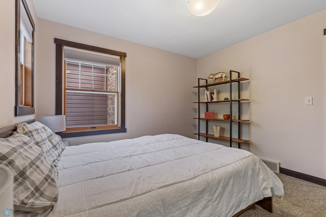 carpeted bedroom featuring multiple windows