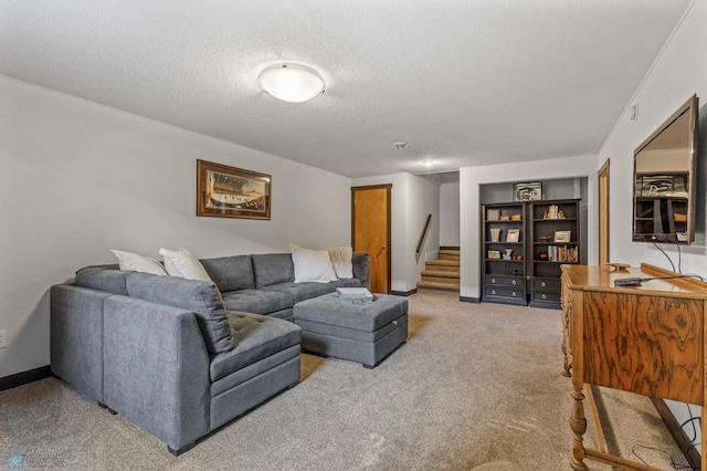 carpeted living room with a textured ceiling