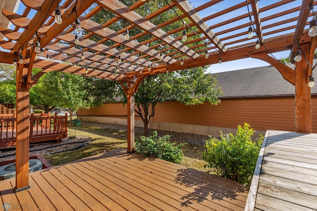 wooden deck featuring a pergola