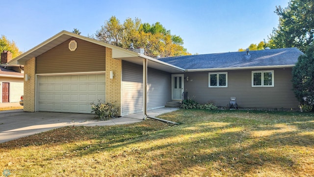 ranch-style home with a front yard and a garage