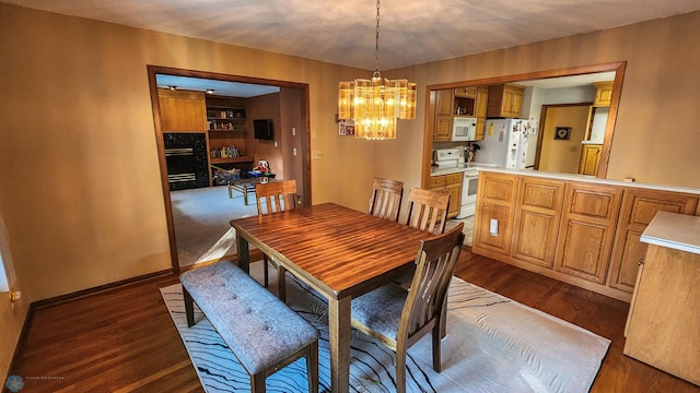 dining area featuring a notable chandelier and dark hardwood / wood-style floors