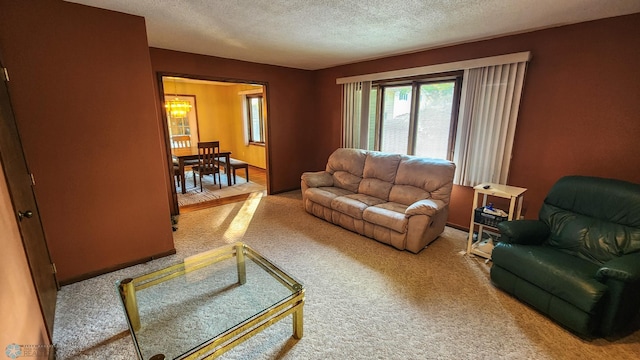 carpeted living room featuring a textured ceiling