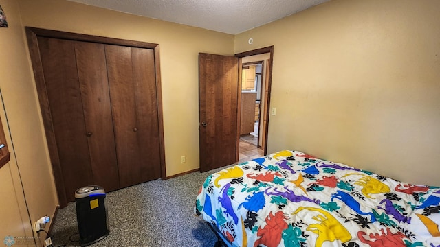 bedroom with a closet and a textured ceiling