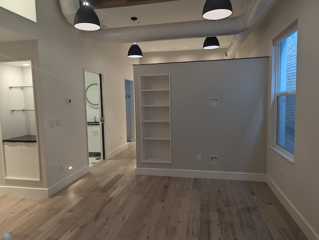 empty room with hardwood / wood-style floors