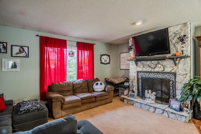 carpeted living room featuring a textured ceiling and a fireplace