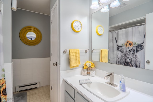 bathroom with vanity and a baseboard radiator