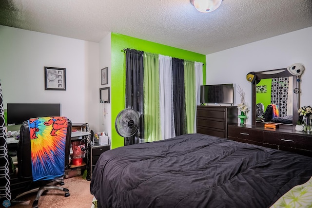 carpeted bedroom featuring a textured ceiling