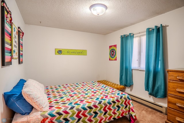 carpeted bedroom featuring a baseboard radiator and a textured ceiling