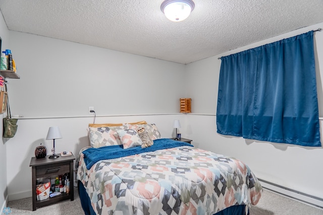 bedroom with carpet floors, a textured ceiling, and a baseboard radiator