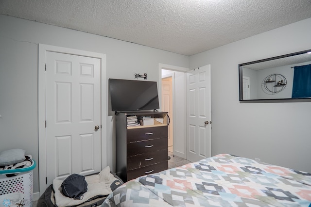 bedroom featuring a textured ceiling