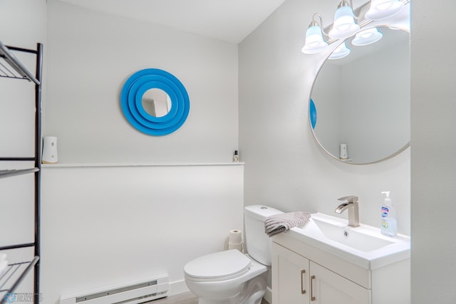 bathroom featuring baseboard heating, vanity, and toilet