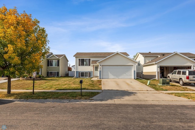 view of front of home featuring a front yard and a garage