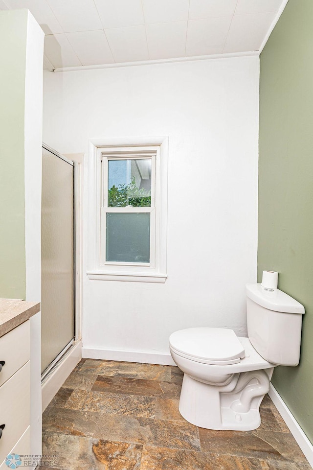 bathroom featuring hardwood / wood-style floors, an enclosed shower, vanity, and toilet