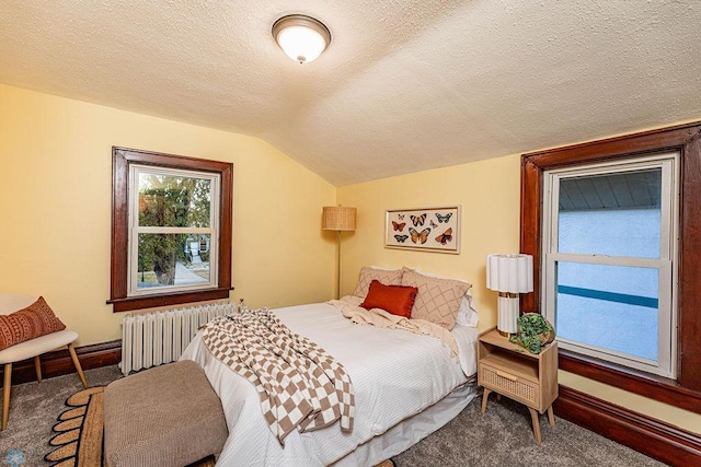 bedroom featuring a textured ceiling, radiator, vaulted ceiling, and carpet flooring