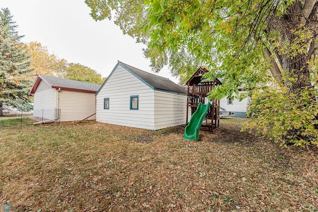 view of property exterior with a playground and a yard