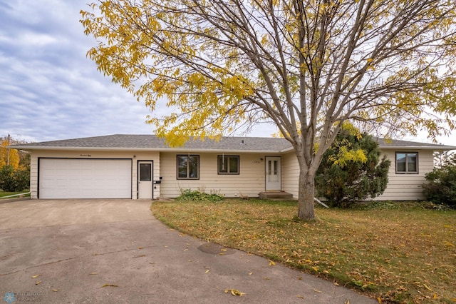 single story home with a front lawn and a garage