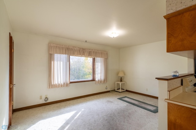 interior space featuring light colored carpet