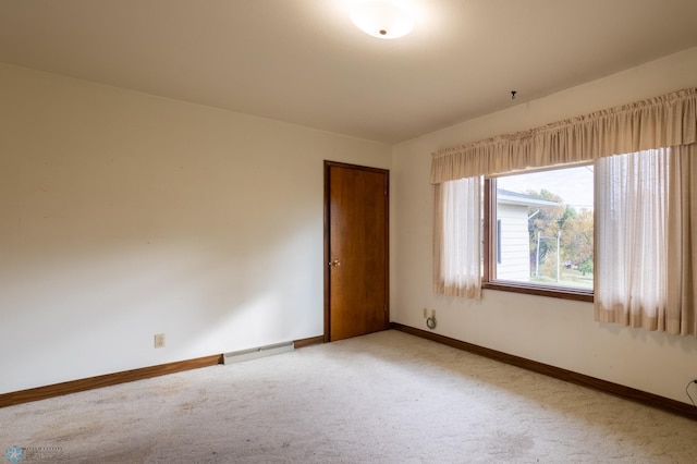 empty room with light colored carpet