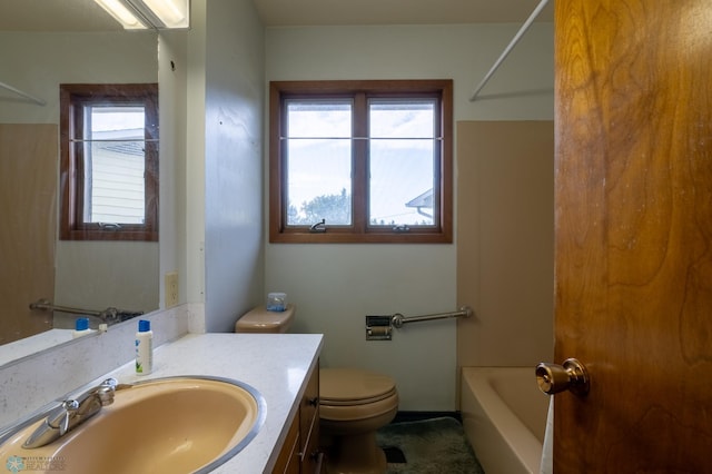 full bathroom with  shower combination, vanity, and toilet