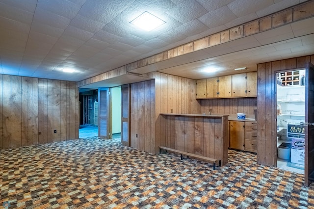 bar featuring wood walls