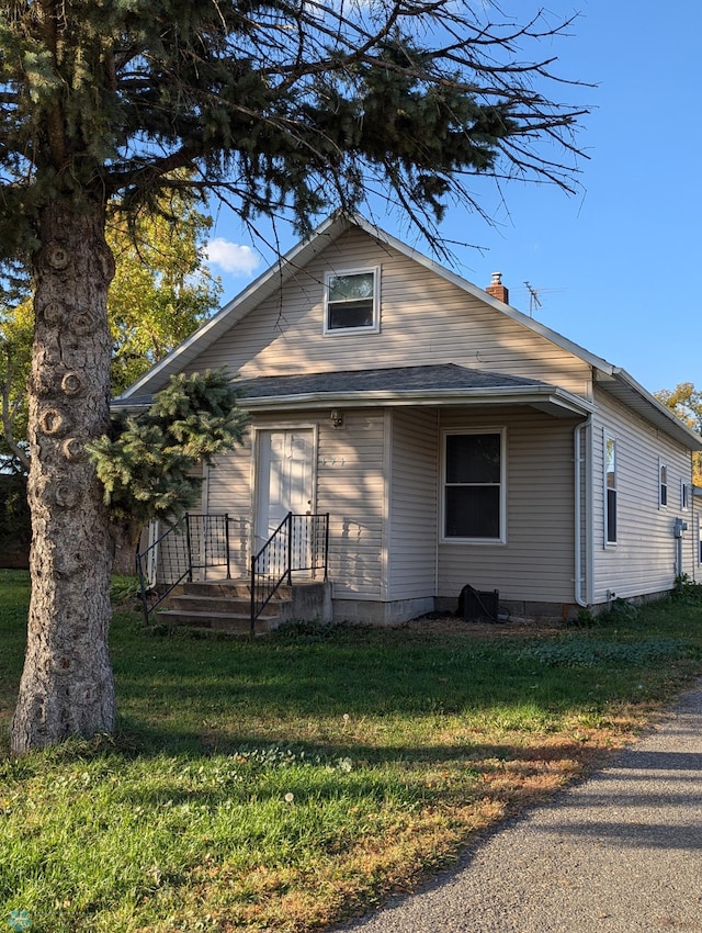 view of home's exterior with a lawn