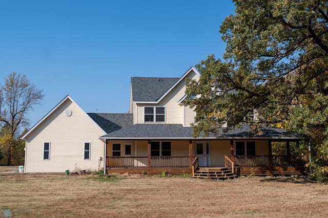 view of front of house with a front lawn and a wooden deck