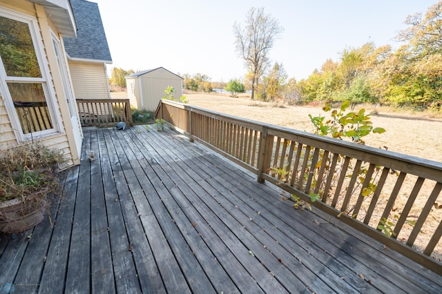 wooden deck featuring a storage unit