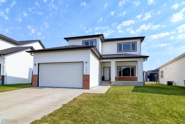 view of front of house with a garage, central AC, and a front lawn