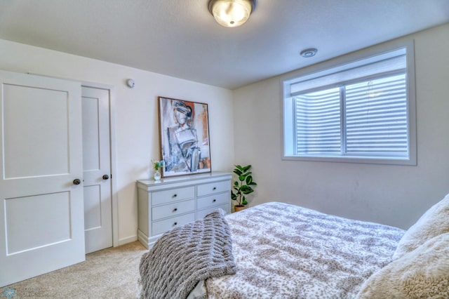 bedroom with light colored carpet