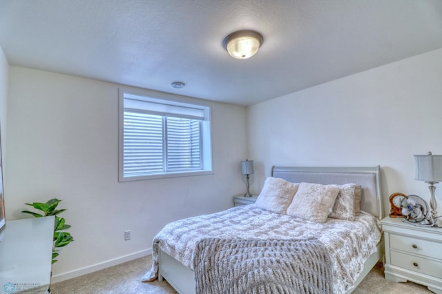 carpeted bedroom featuring a textured ceiling