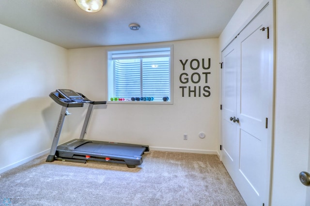 exercise room with light colored carpet