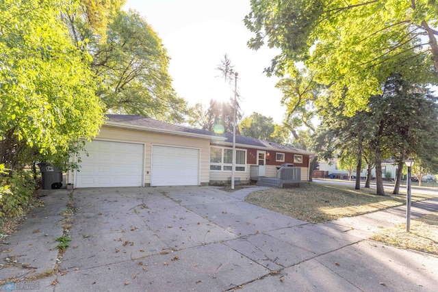 ranch-style home with a garage