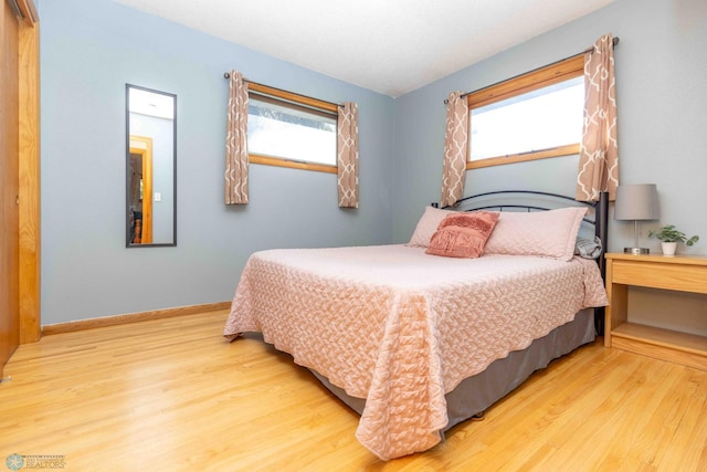 bedroom with light hardwood / wood-style flooring