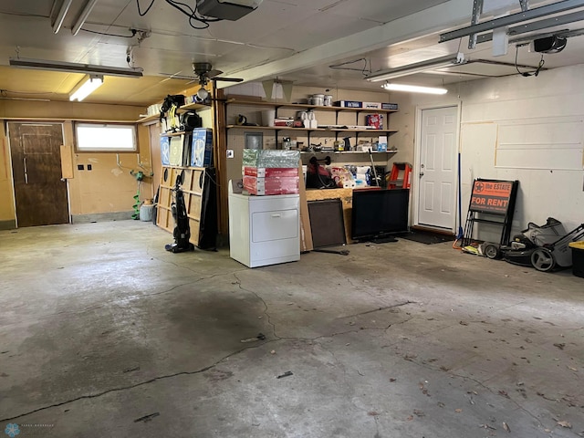 garage with ceiling fan and a garage door opener