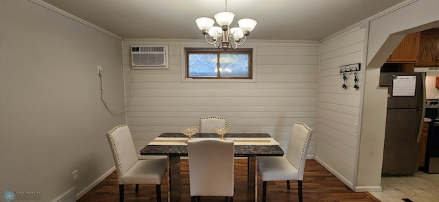 dining space featuring ornamental molding, a wall mounted air conditioner, a chandelier, and dark hardwood / wood-style flooring