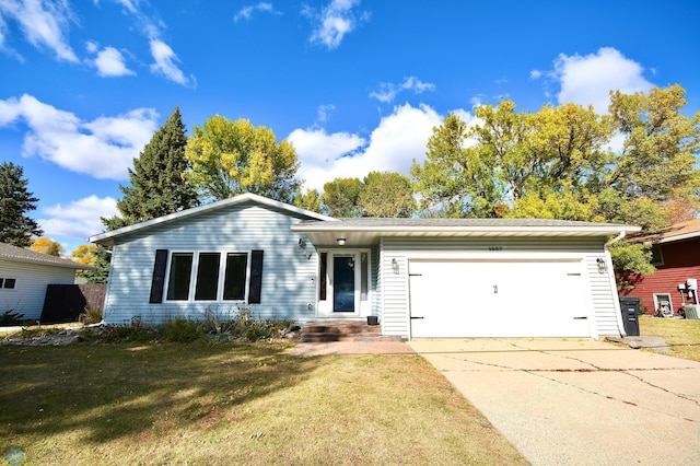 ranch-style house with a garage and a front lawn