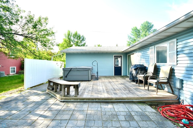 deck with a hot tub