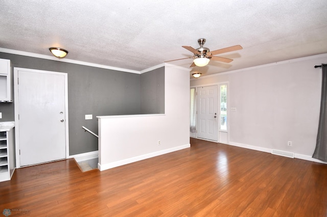 unfurnished living room with crown molding, ceiling fan, wood-type flooring, and a textured ceiling