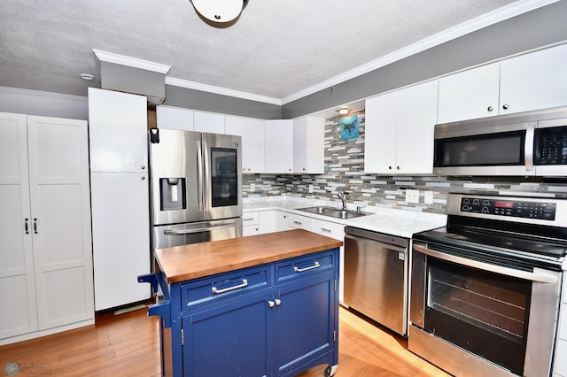 kitchen with light wood-type flooring, sink, white cabinetry, appliances with stainless steel finishes, and blue cabinets