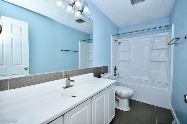 full bathroom with shower / bathing tub combination, vanity, and toilet