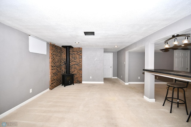 basement with a textured ceiling and light carpet