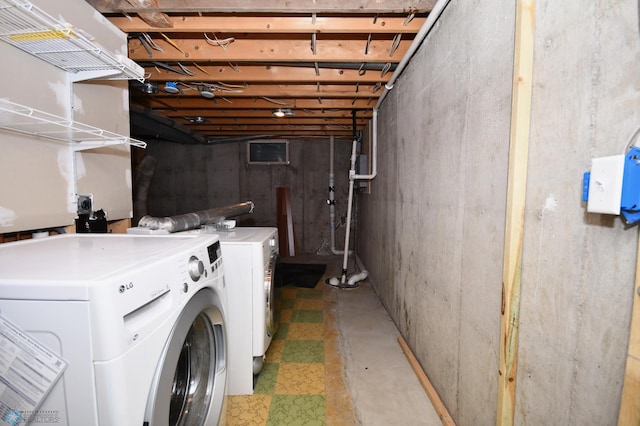 washroom with washing machine and clothes dryer