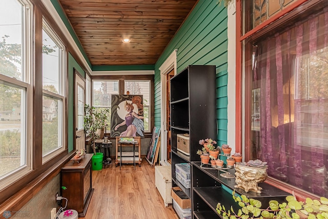 unfurnished sunroom featuring wood ceiling