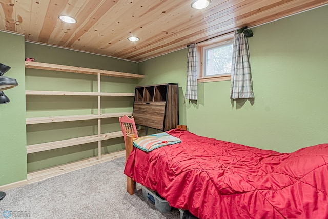 carpeted bedroom featuring wood ceiling