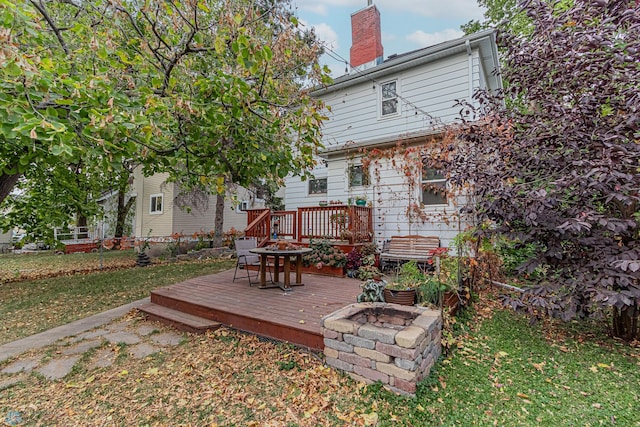 rear view of property with a wooden deck