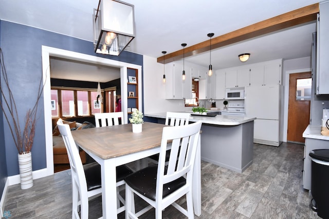 dining space featuring dark hardwood / wood-style floors